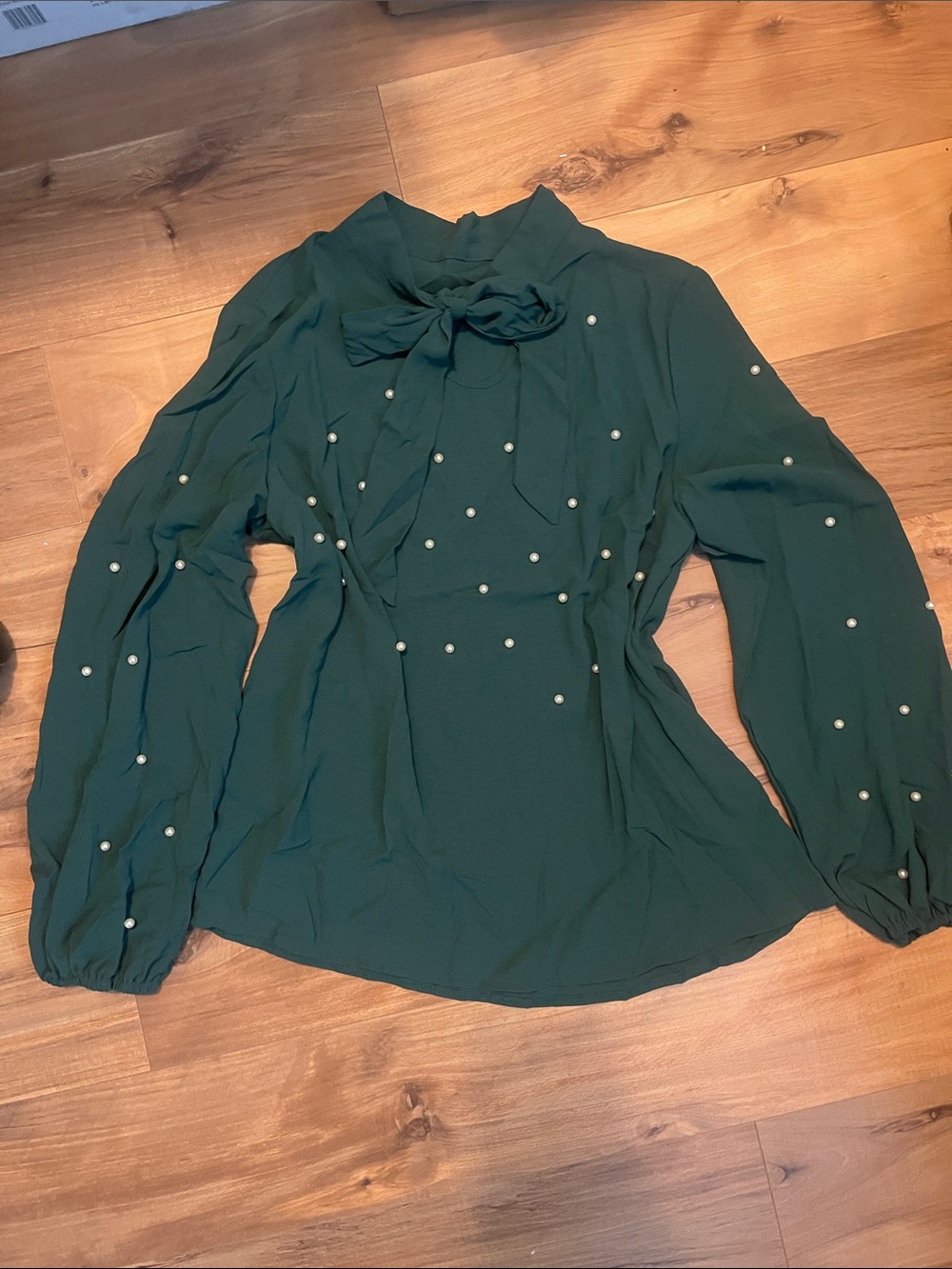 Woman’s green blouse with Pearl accents
